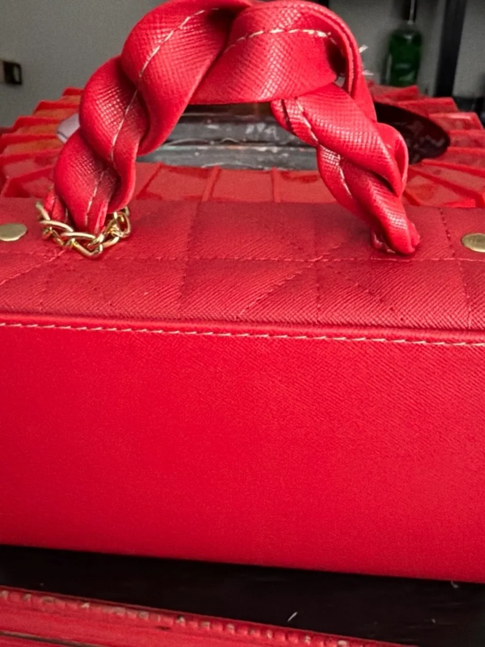 Quilted Red Crossbody Bag with Braided Handle and Tassel